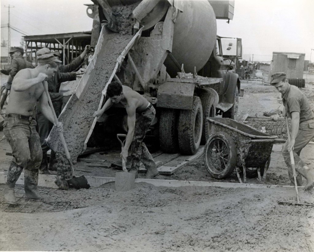 Seabees from the Naval Mobile Construction Battalion (NMCB) 9 pour cement for a foundation on Da Nang (Đà Nẵng), Vietnam.